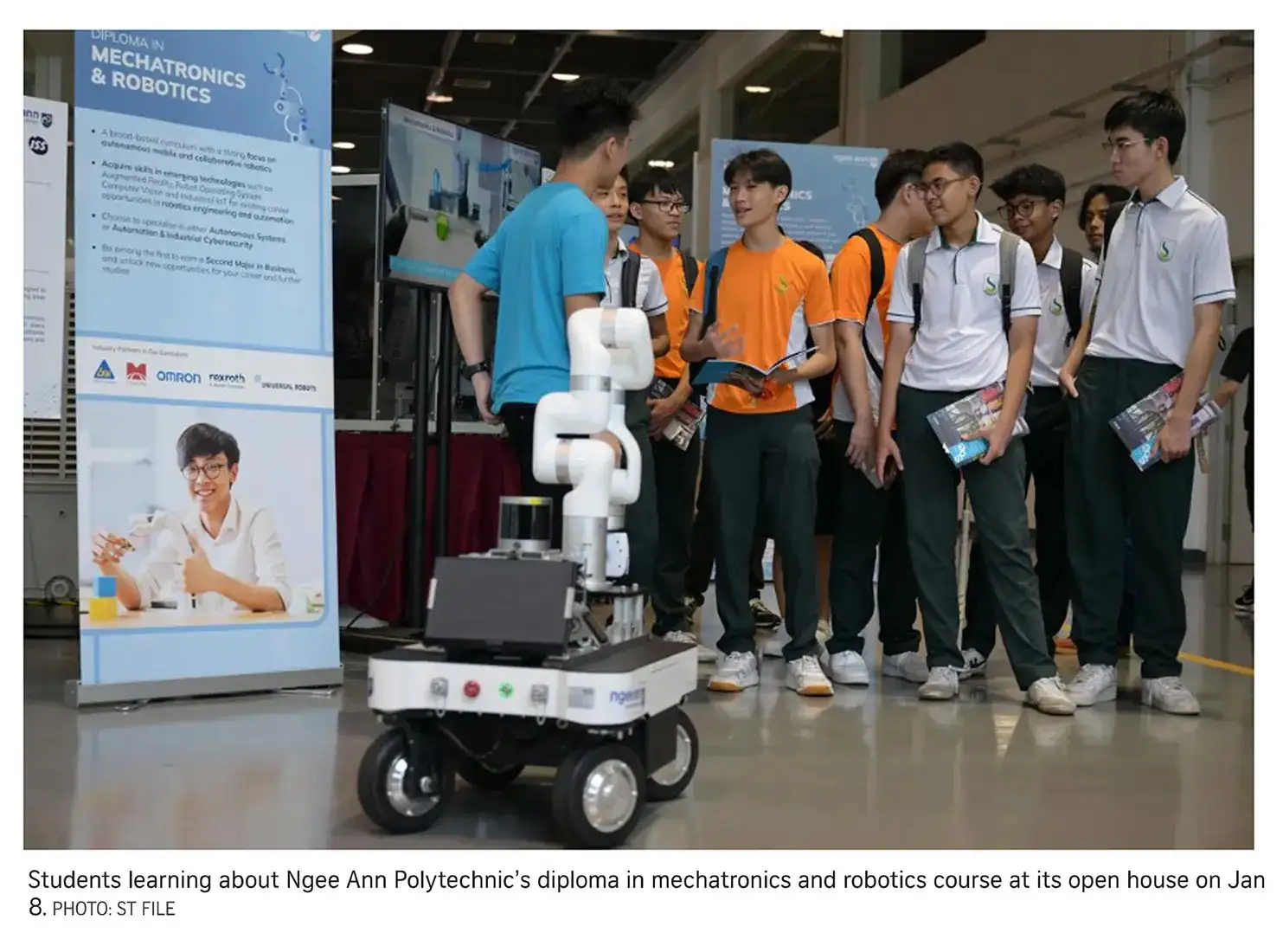 Students learning about Ngee Ann Polytechnic's diploma in mechatronics and robotics course at its open house on Jan 8.